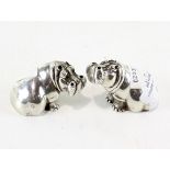 A pair of contemporary silver salts in the form of seated Hippos by Patrick Mavros,