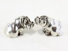 A pair of contemporary silver salts in the form of seated Hippos by Patrick Mavros,