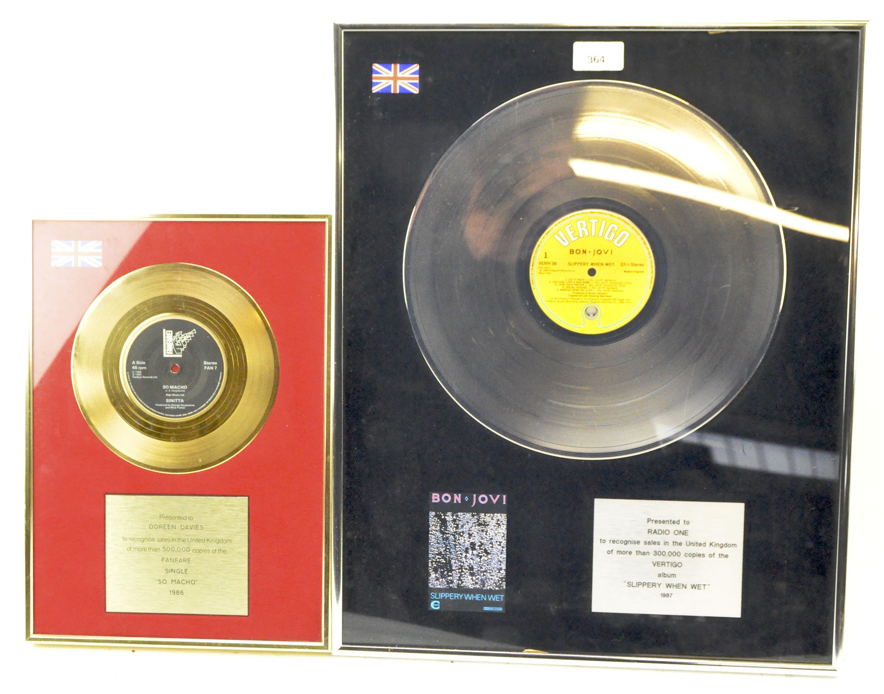 Two presentation vinyl plaques,