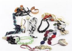 An assortment of vintage costume jewellery, to include chains,