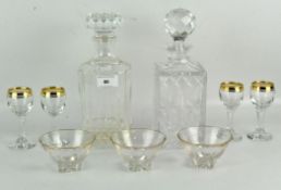 Two 20th century moulded glass decanters with stoppers,