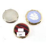 Three lady's compacts, one silver example with textured decoration, hallmarked Birmingham 1960,