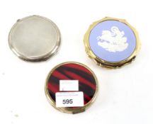 Three lady's compacts, one silver example with textured decoration, hallmarked Birmingham 1960,