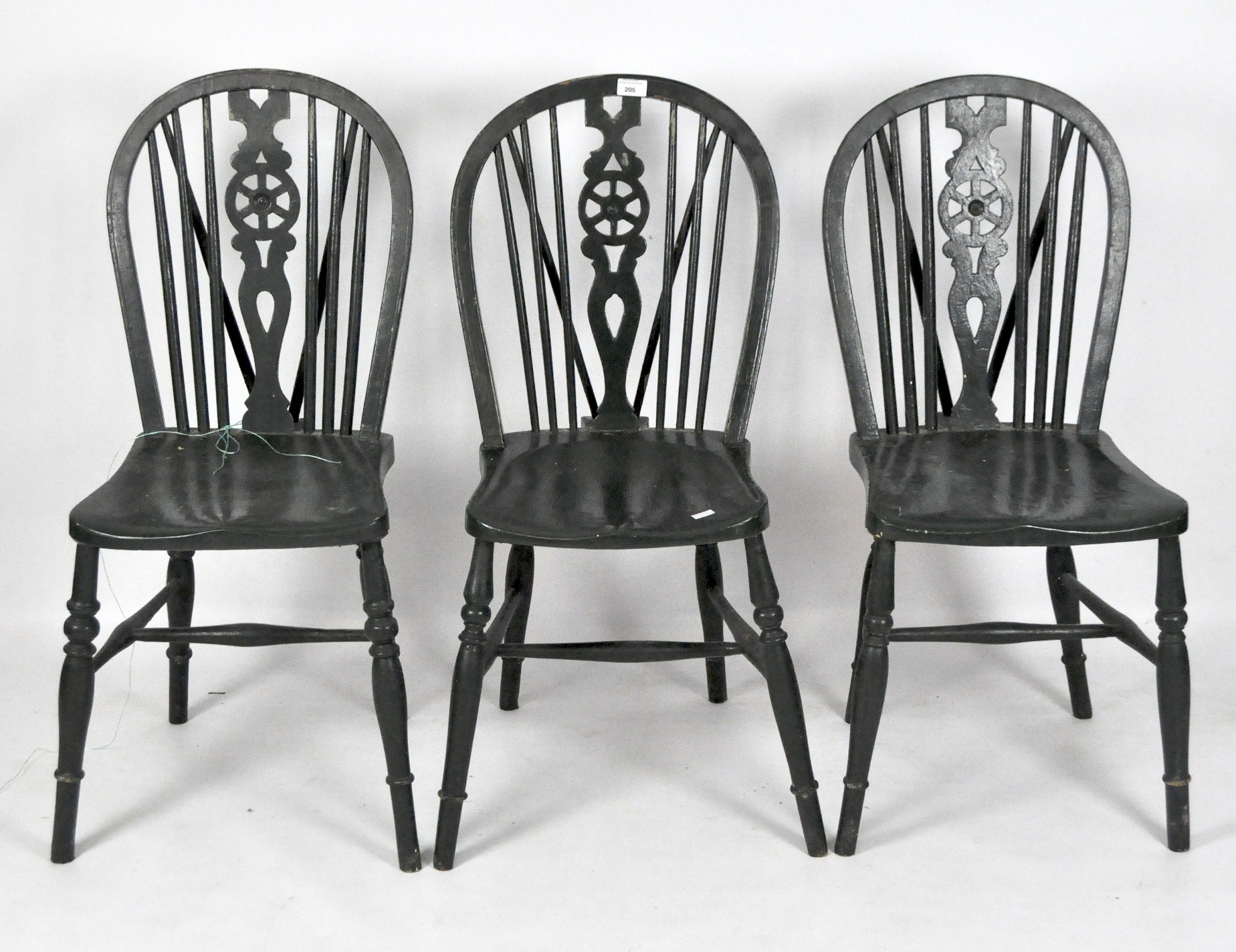 Three green painted wooden wheelback kitchen chairs,