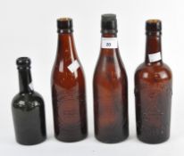Four early 20th century glass bottles,