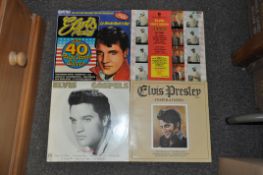 A cased collection of Elvis Presley records, mostly singles,