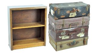 A selection of four vintage suitcases and a two tier bookshelf unit,