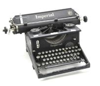 An Imperial typewriter, in black with the Royal coat of arms decal to the front,