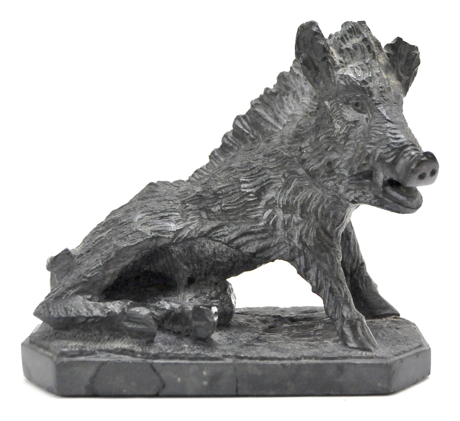 A vintage stone sculpture modelled as a wild boar,