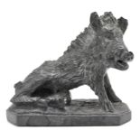 A vintage stone sculpture modelled as a wild boar,