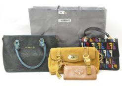 A collection of handbags and purses,