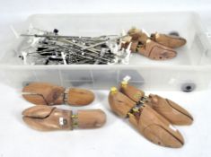 A collection of wooden shoe lasts and clothes hangers,