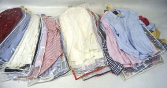 A large collection of men's shirts, including blue, white, pink, cream and striped examples,