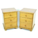A pair of contemporary pine bedside cabinets,