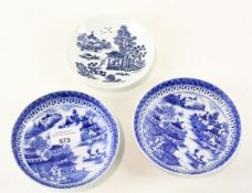 Three 19th century blue and white glazed ceramic dishes, each depicting traditional Oriental scenes,