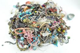 A large collection of costume jewellery, containing an assortment of beads, necklaces, bracelets,