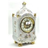 Early 20th century continental mantle clock, the ceramic and gilt dial with Arabic numerals,