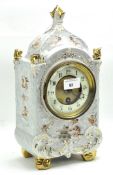 Early 20th century continental mantle clock, the ceramic and gilt dial with Arabic numerals,