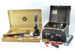 A microphone and a selection of vintage tools,