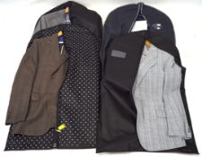 A selection of mens clothing, to include an Austin Reed suit jacket, another by Chester,