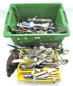 A large collection of flatware and tools,