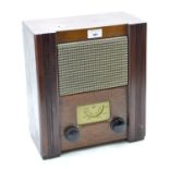 A mid century wooden cased radio, with label to reverse reading "wartime civilian receiver"
