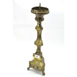 A late 19th/early 20th century brass candlestick,