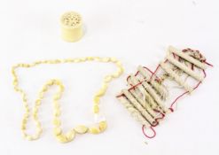 A selection of late 19th/early 20th century ivory wares, to include a bead necklace,