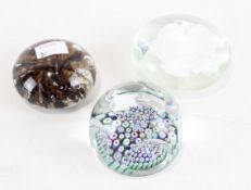 A Whitefriars paperweight and two others,
