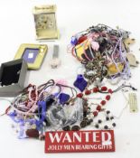 A quantity of costume jewellery, including a silver pendant, necklaces, bracelets,