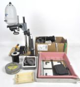 A Gnome Beta 35 photographic enlarger together with other darkroom equipment