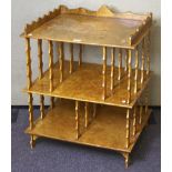 An early 20th century burr wood veneered three tier shelf unit,