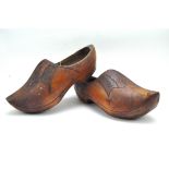 A pair of 20th century wooden clogs,