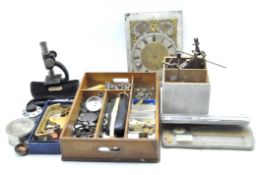 A collection of assorted clock and watch related accessories,