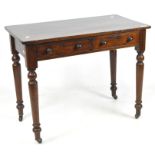 A Victorian mahogany side table with two drawers featuring turned wood handles,