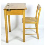 A vintage pine school desk with original chair,