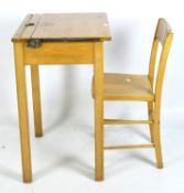 A vintage pine school desk with original chair,