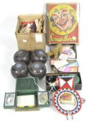 A collection of vintage magic tricks, a set of Banda carpet bowls, 4 Penshurs bowling bowls,