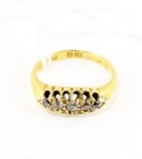 A 20th century 18ct gold and diamond set ring, the yellow band set with five small diamonds,