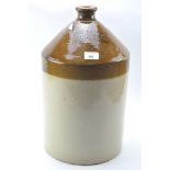 An early 20th century Stoneware liquid jug, from John White & Co, wine and spirit merchants,