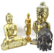 Three gilt Buddhas and a carved wooden face mask,