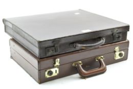 Two brown leather briefcases,