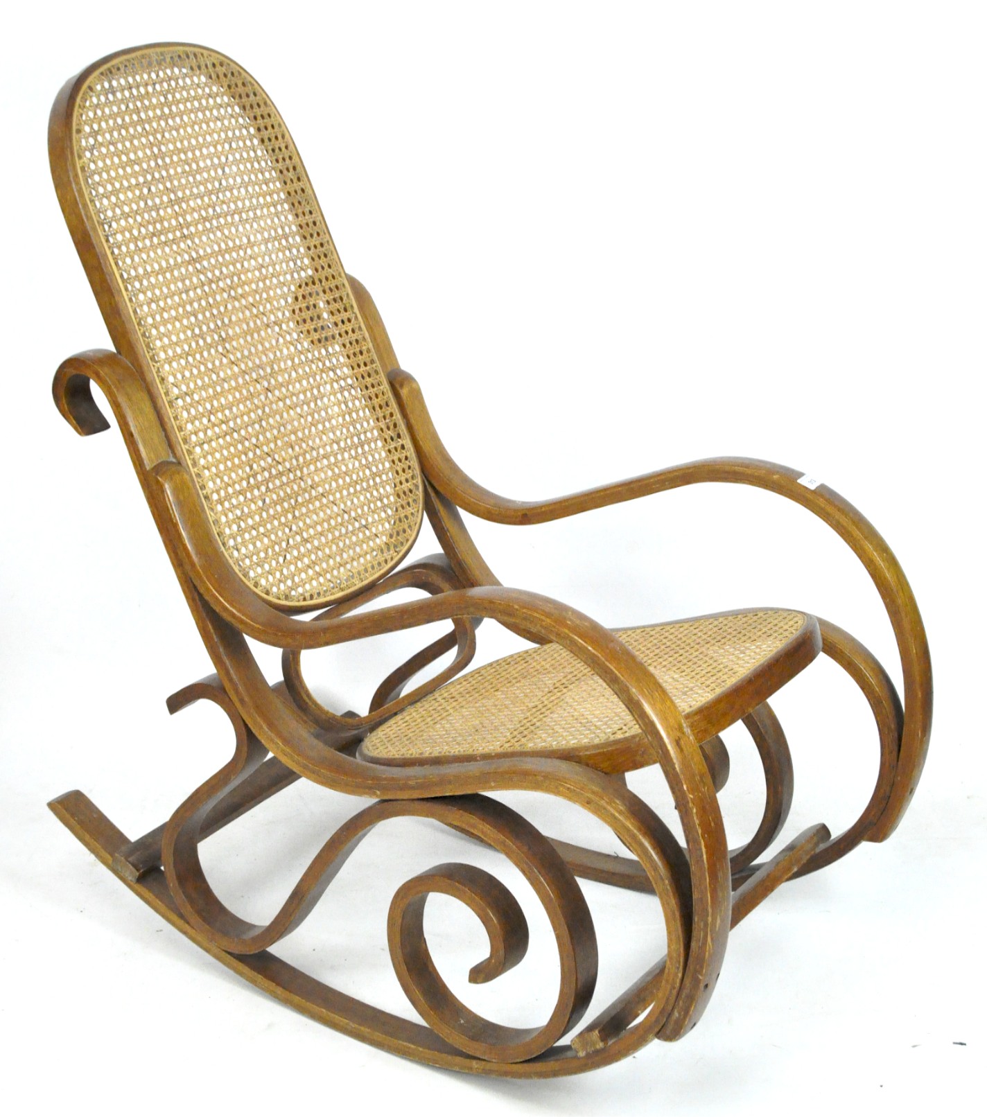 An early 20th century bentwood and bergere rocking chair,