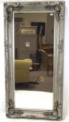 A large contemporary wall mirror,