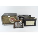 Three vintage radios and a mantle clock,