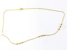 A 9ct gold chain, the links consistently featuring gold beaded details