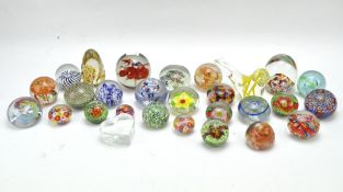 A collection of contemporary glass paperweights,