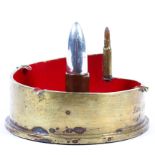 A Trench Art ashtray, with brass shell base and shell shaped lighter case.