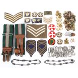 A collection of assorted military cloth badges and buttons,