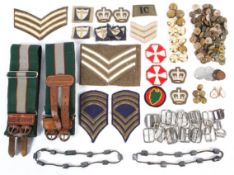 A collection of assorted military cloth badges and buttons,